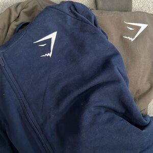 Navy & green Gymshark zip up sweatshirts